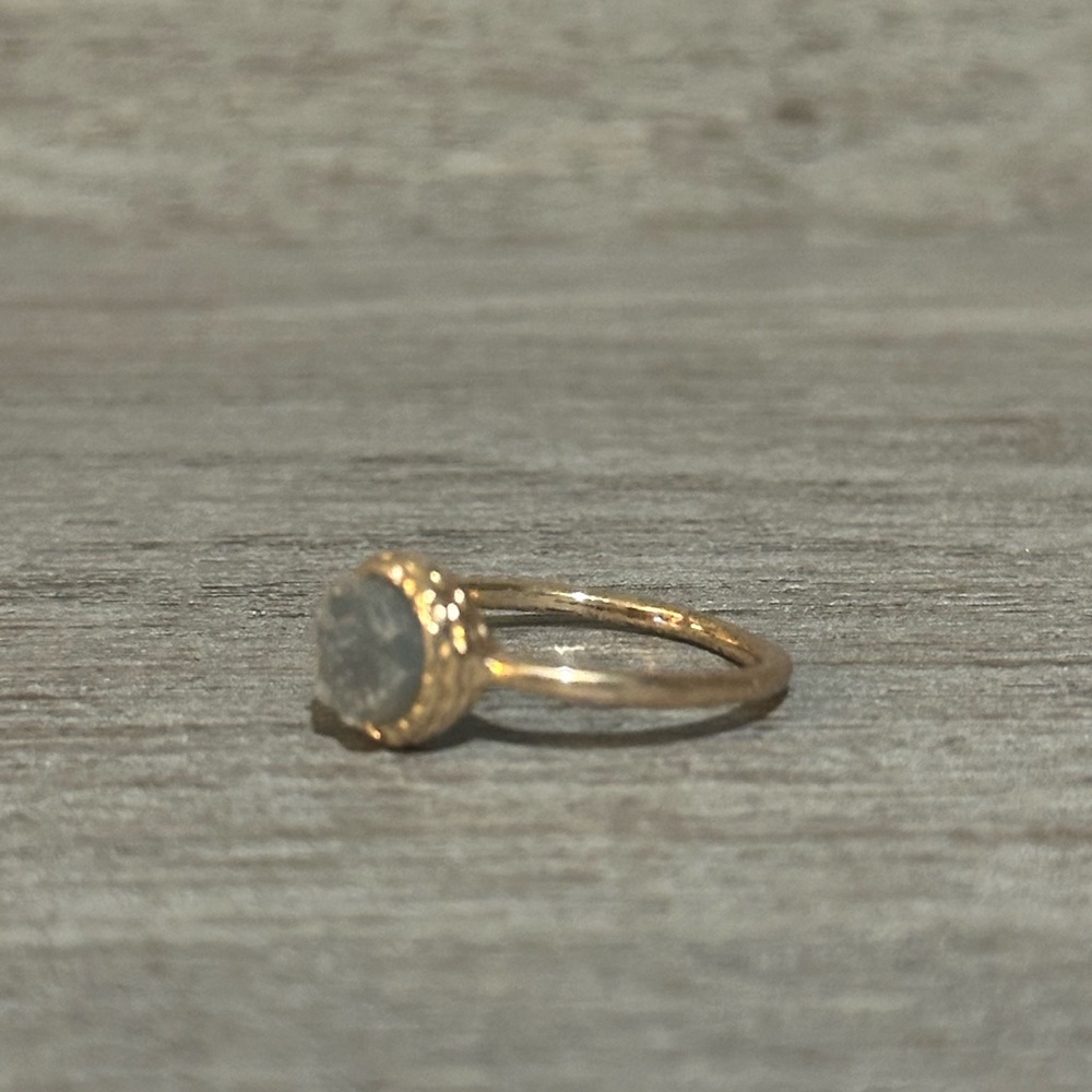 Elegant Gold Ring with a Gray Stone